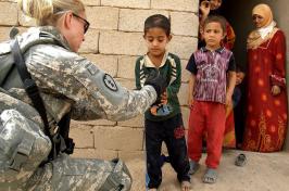 Soldier greeting children 
